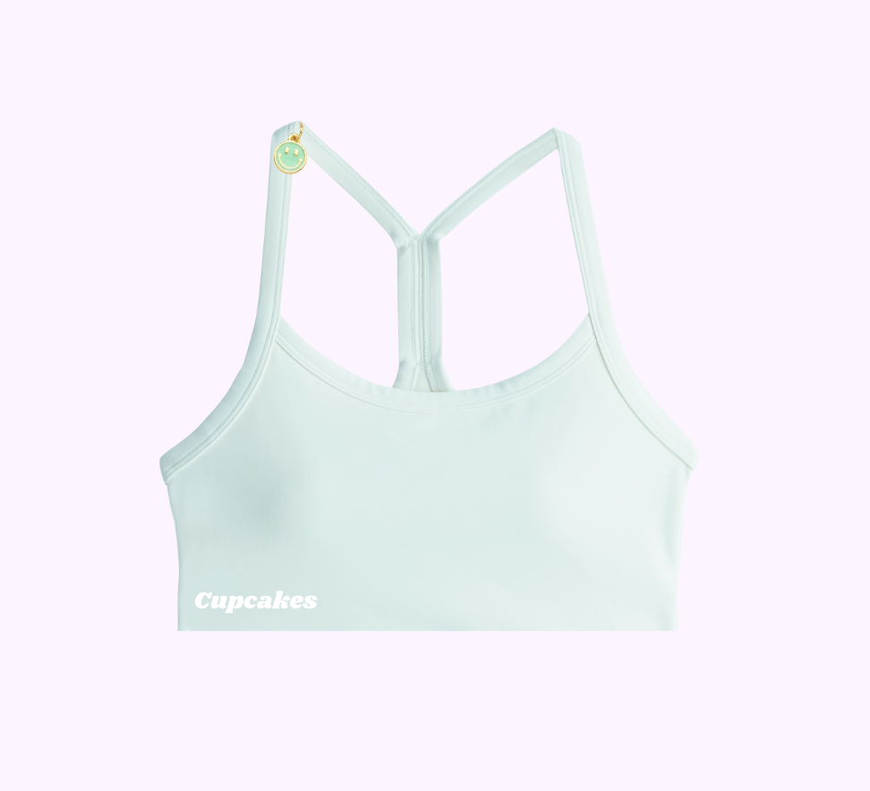 A single green leaf against a white background.